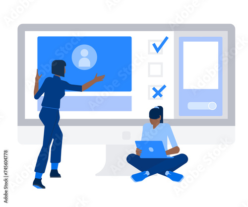 Women create a website using a laptop and a desktop computer