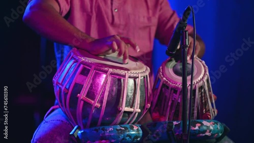 Musician seen playing tabla during event
