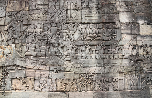 Wall carving of Prasat Bayon Temple in famous landmark Angkor Wat complex, Siem Reap, Cambodia. Bas-relief depicting peasants going about daily routine