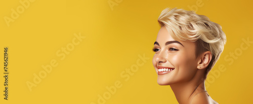 Portrait of a beautiful, sexy Caucasian woman with perfect skin and white short hair, on a yellow background.