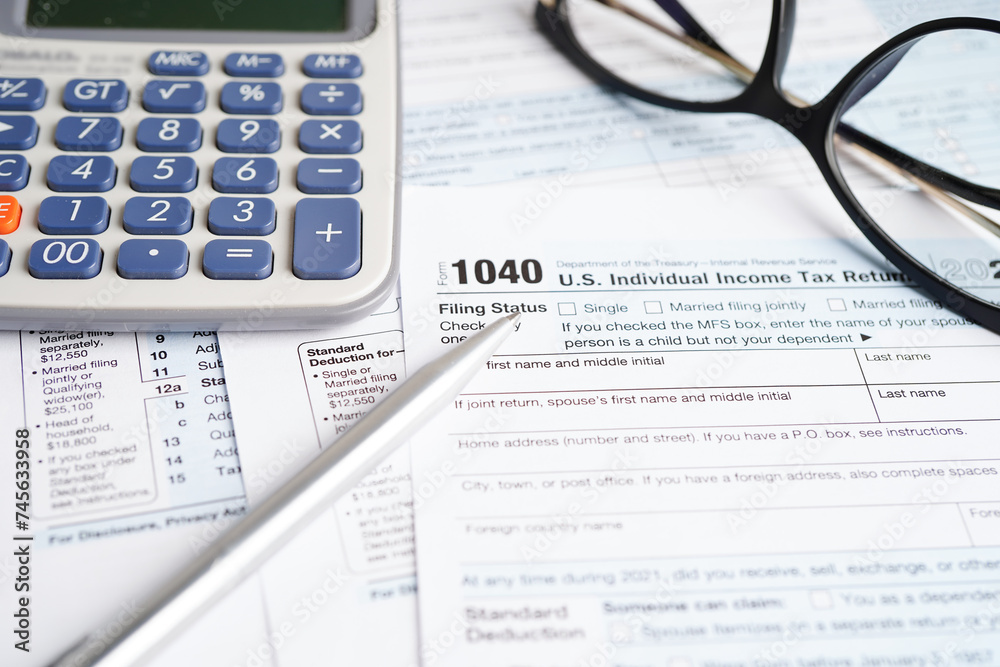 Tax form 1040 U.S. Individual Income Tax Return, business finance concept. Tax form 1040 U.S. Individual Income Tax Return, business finance concept.