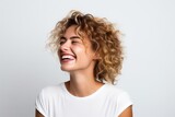 Portrait of a happy young woman with curly hair on white background
