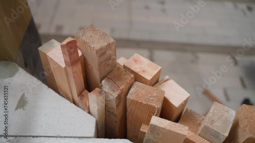 Wooden blocks in a warehouse, close-up. Different sized pine boards in the workshop, smooth camera movement photo