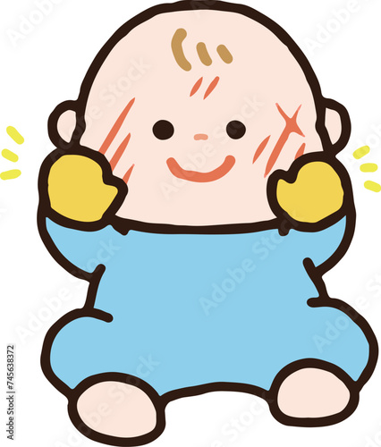 	手袋をつけて顔を傷つけるのを防ぐ赤ちゃん