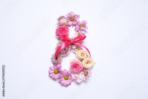 8 March greeting card design made with beautiful flowers on white background  top view. Space for text