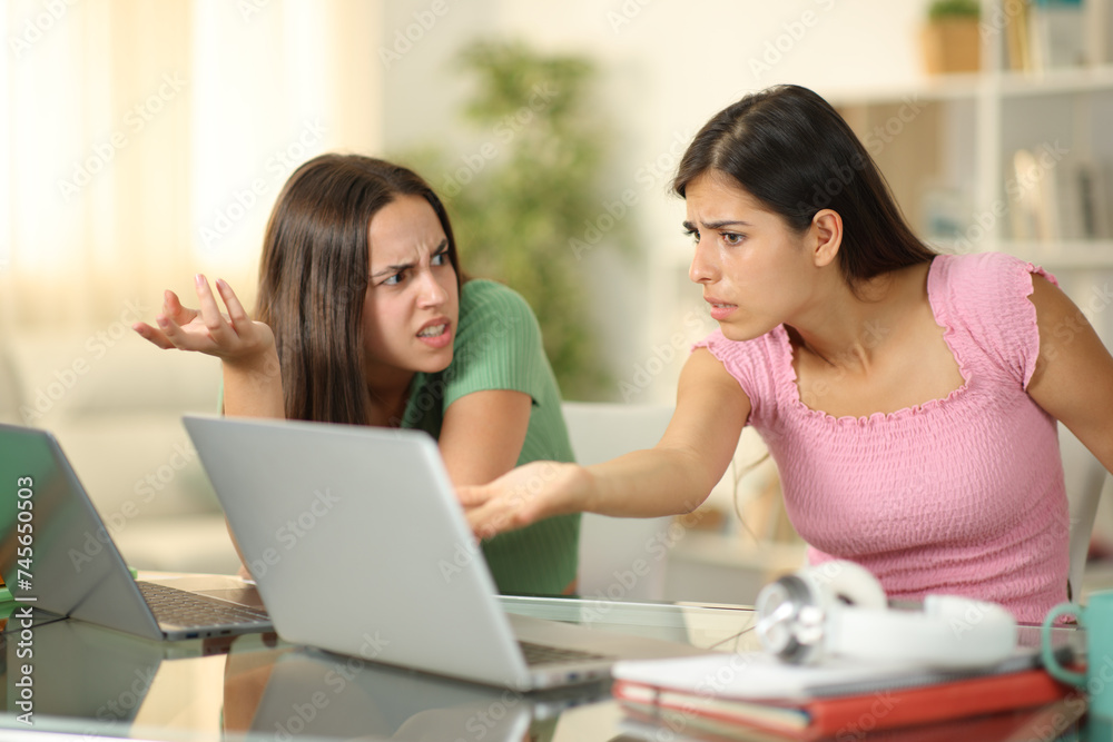 Angry students arguing studying online Angry students arguing studying online