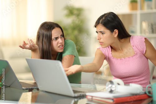 Angry students arguing studying online
