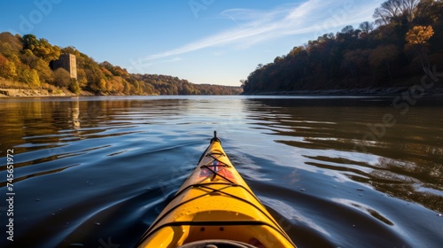 Paddling a kayak along a scenic river with ample copy space for text and designs
