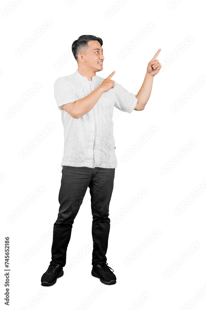 Smiling asian man pointing at something isolated on white background