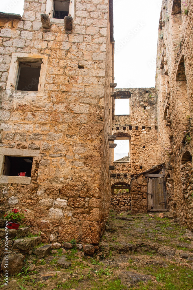 'House Within a House' or Kuca U Kuci in Bol, Brac Island, Croatia. In 19th century, a newer house was built around an existing house which was never demolished 'House Within a House' or Kuca U Kuci in Bol, Brac Island, Croatia. In 19th century, a newer house was built around an existing house which was never demolished