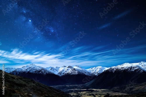 Starry night sky above mountains with visible Milky Way © Photocreo Bednarek