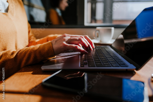 Freelancer using laptop in cafe