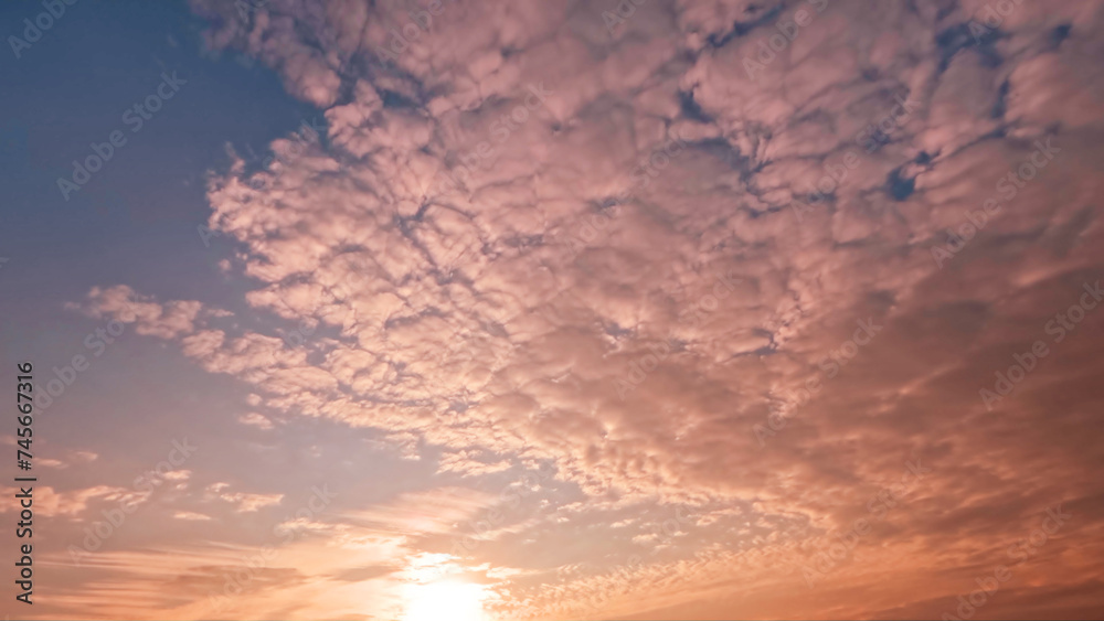 Fototapeta premium cute sunrise golden clouds on the sky backdrop - photo of nature