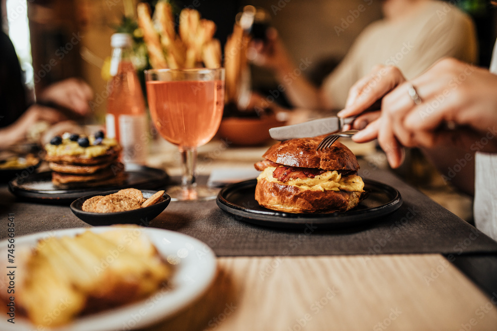 Burger served menu with drinks on table Burger served menu with drinks on table