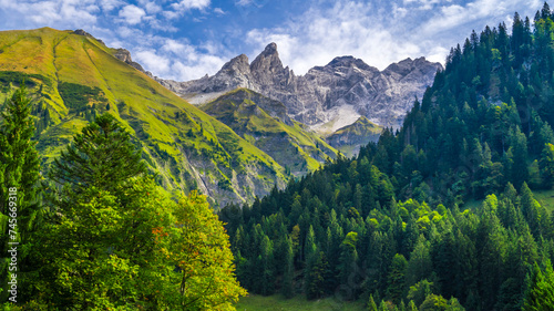 Germany, Bavaria, Oberstdorf, Scenic view of forested valley in Allgau Alps photo