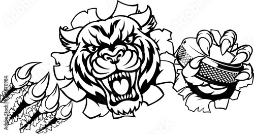 A tiger ice hockey player animal sports mascot holding a puck