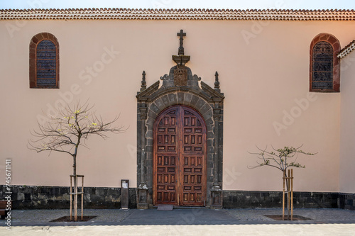 Ancient wooden door to the Immaculate Conception Church, in the old city of La Laguna, Tenerife (Spain). The full name of the church is: Iglesia-Parroquia Matriz de Nostra Señora de La Concepción photo