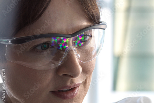 Scientist examining molecular structure in laboratory