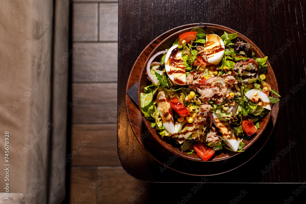 Mixed healthy salat served in wooden plate on background Mixed healthy salat served in wooden plate on background