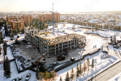 Photography the construction site of an apartment building in the winter from a height