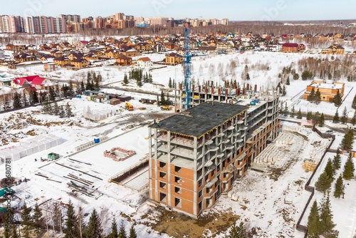 Photography the construction site of an apartment building in the winter from a height