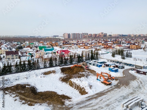 Photography the construction site of an apartment building in the winter from a height