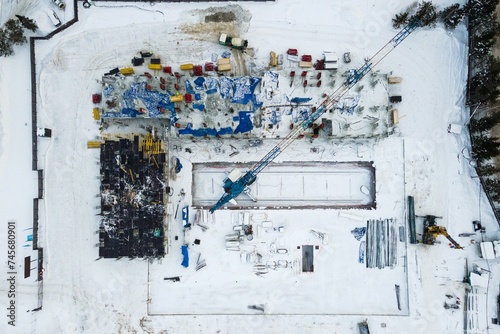 Photography the construction site of an apartment building in the winter from a height