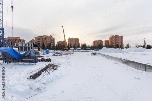 Photography the construction site of an apartment building in the winter from a height