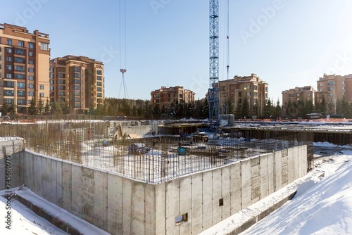 Photography the construction site of an apartment building in the winter from a height