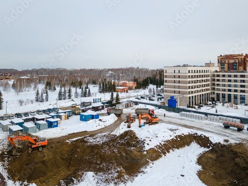 Photography the construction site of an apartment building in the winter from a height