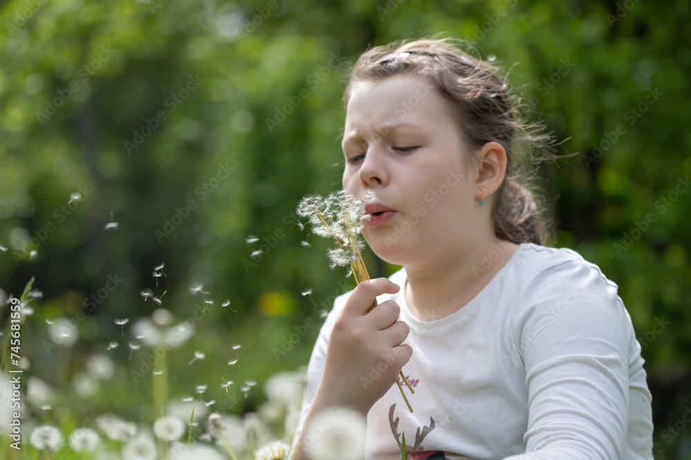 Summer joy - lovely girl blowing dandelion Summer joy - lovely girl blowing dandelion