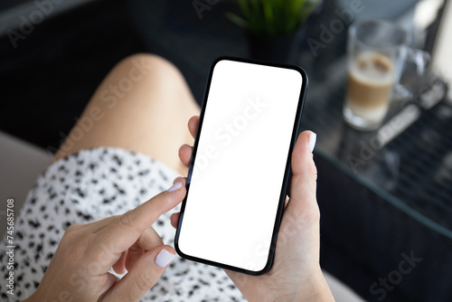 woman hand hold phone with isolated screen background cafe office