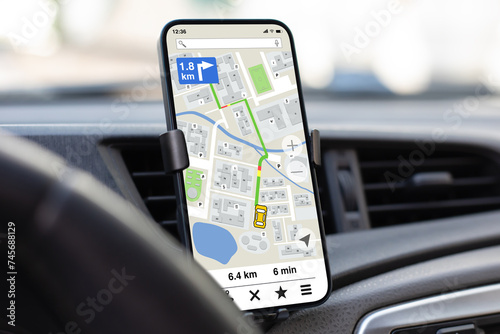 phone with navigation application background of steering wheel in car