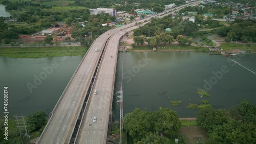 Aerial view urban cityscape timelapse of traffic on the bridge with high buildings city of Thailand