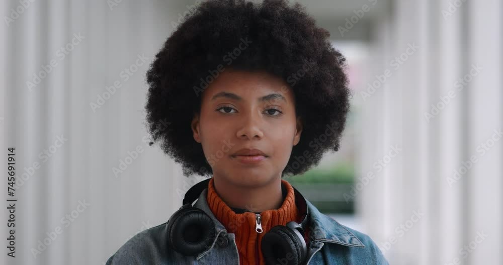 Portrait of young happy african american student girl with hair is ...