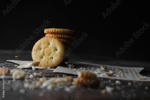 Cookies kept on a wooden table on a dark background photo