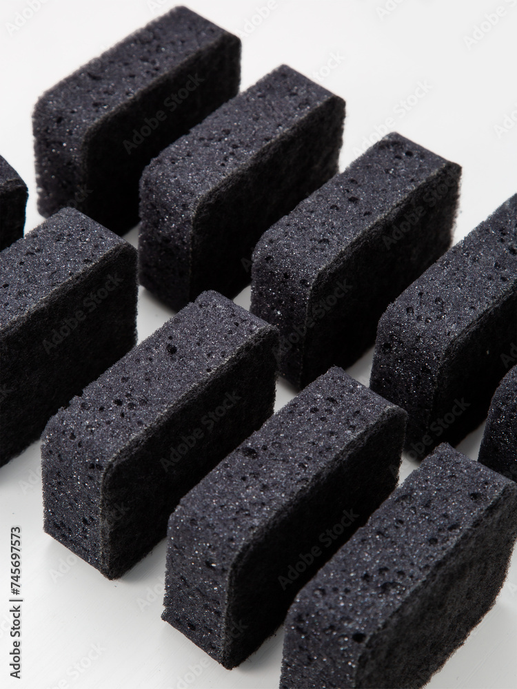 set of black sponges for washing dishes on a white background set of black sponges for washing dishes on a white background
