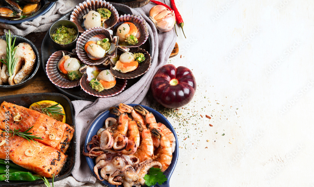 Set of Seafood dishes on light wooden background. Set of Seafood dishes on light wooden background.