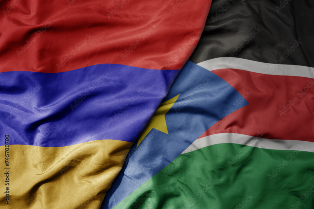 big waving national colorful flag of south sudan and national flag of armenia . big waving national colorful flag of south sudan and national flag of armenia .