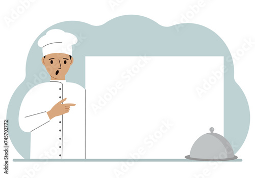 A male cook in uniform and a cap holds a large sheet of paper. Concept for menu, recipe book, blank cookbook or records.