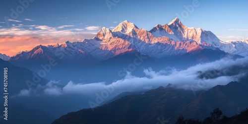 Experience the captivating beauty of nature as the first light adorns the mountain peaks © Irfanan