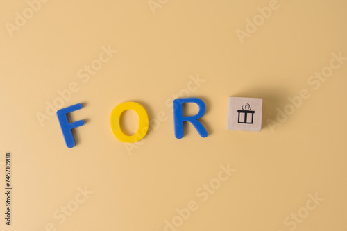 The arranged objects for meaning words 'FORGIVE likes a GIFT'