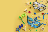 Purim celebration concept (jewish carnival holiday). Hamantaschen cookies over yellow background