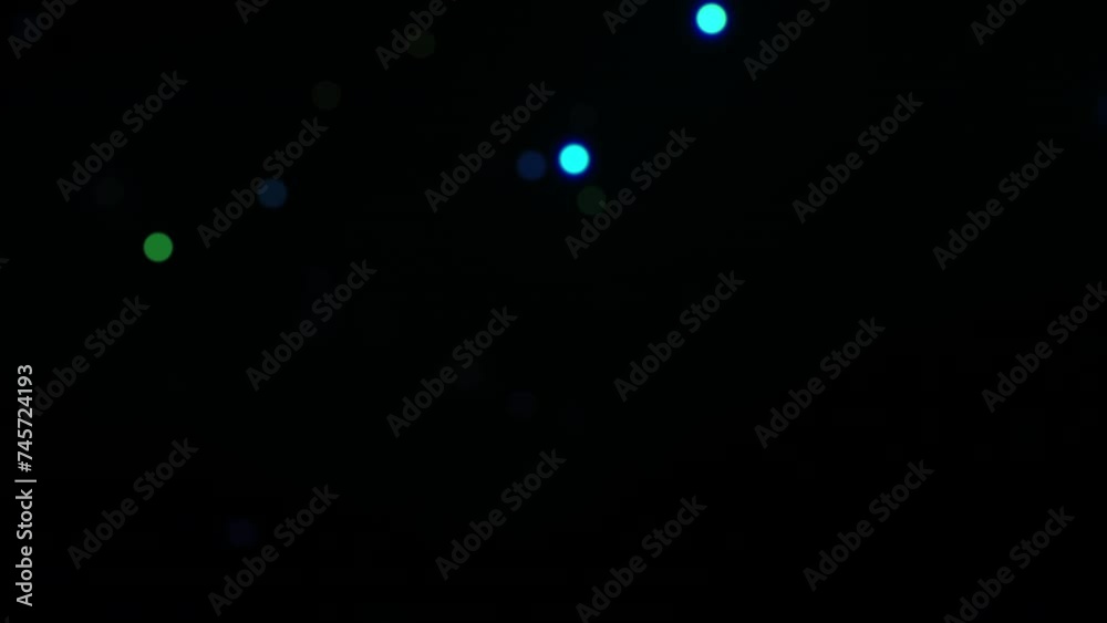 Abstract loop glow colorful bokeh particles floating on black background 4K 3D seamless looping blue bokeh particles dust fly in the air. 
