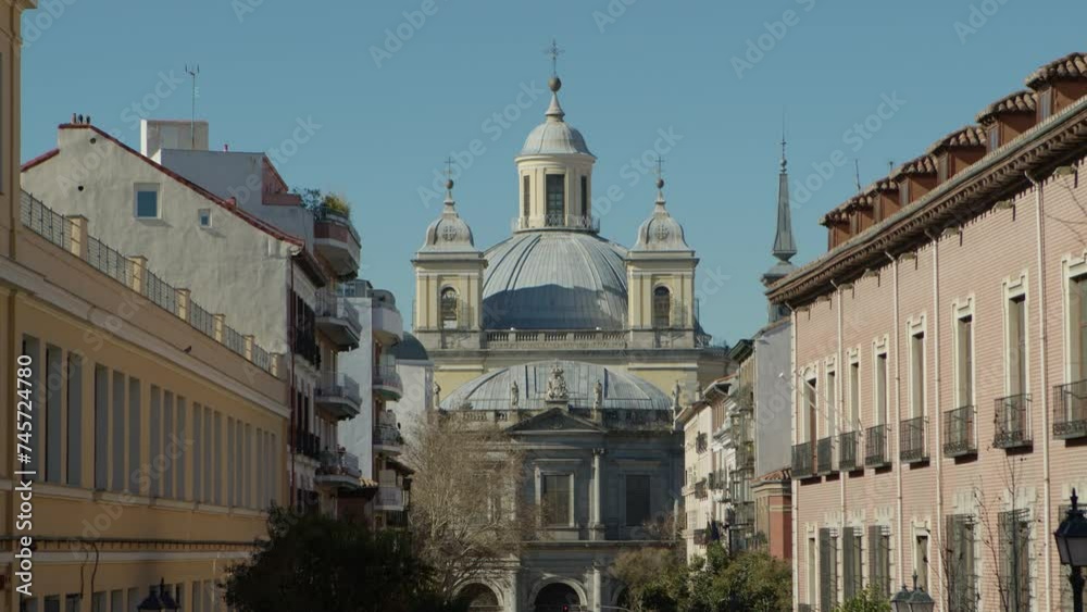 Beautiful general still shot of the Almudena Cathedral between the streets of central Madrid in the morning. Beautiful general still shot of the Almudena Cathedral between the streets of central Madrid in the morning.