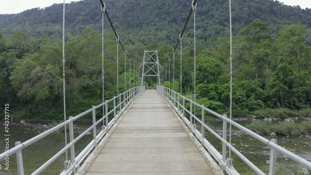 Suspension bridge that stretches over the river Suspension bridge that stretches over the river