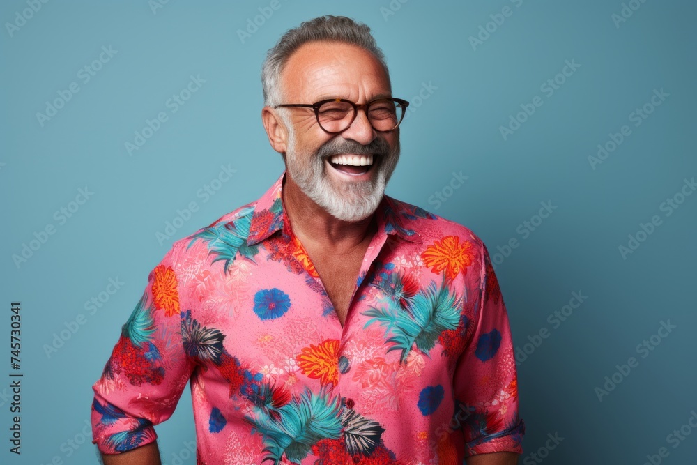 Portrait of a happy senior man with glasses on a blue background Portrait of a happy senior man with glasses on a blue background