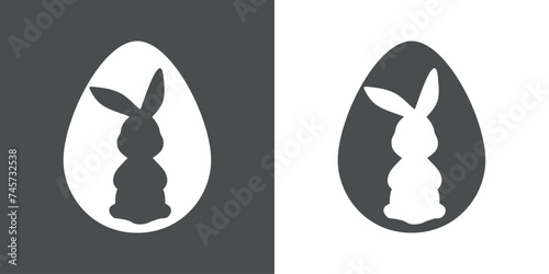 Logo con silueta de Conejo de Pascua en huevo. Silueta de Conejito de Pascua de pie