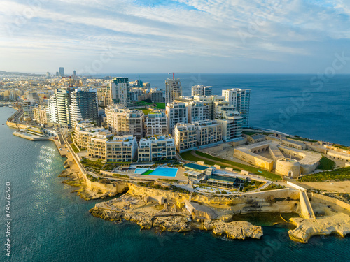 Sunset drone view of apartment and buildings in Sliema, Malta