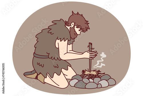 Primitive man on knees near stones for first time breeds bonfire using stick and friction force. Ancient human homo sapiens with beard dressed in skin animal learn to make fire